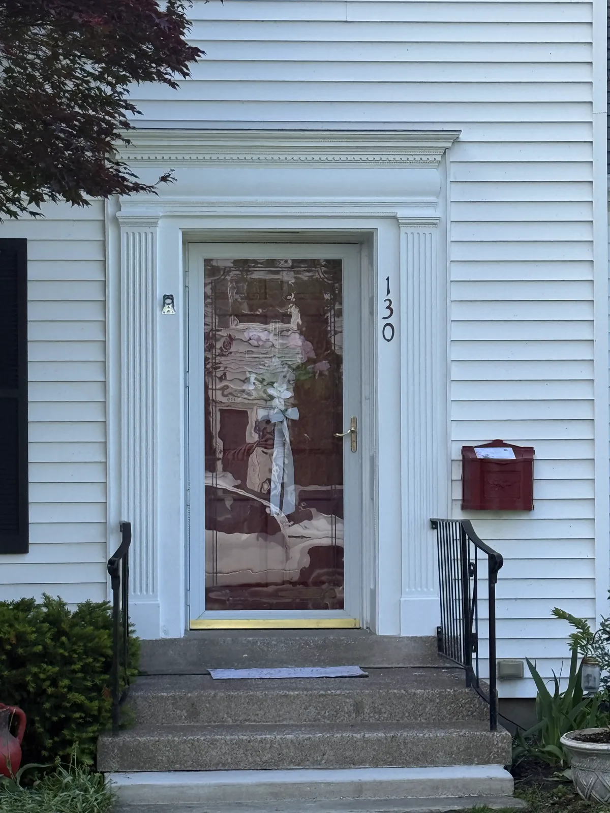 Restored entry with fluted pilasters and fresh paint