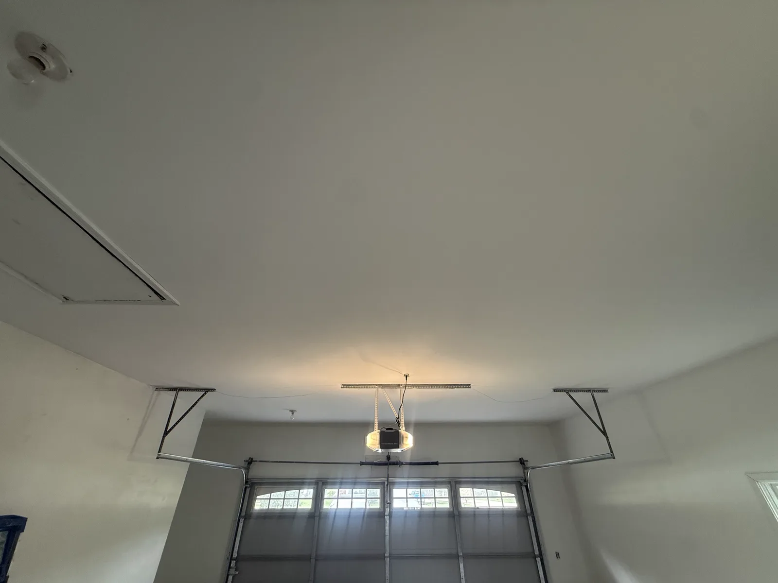 Clean finished garage ceiling after drywall replacement